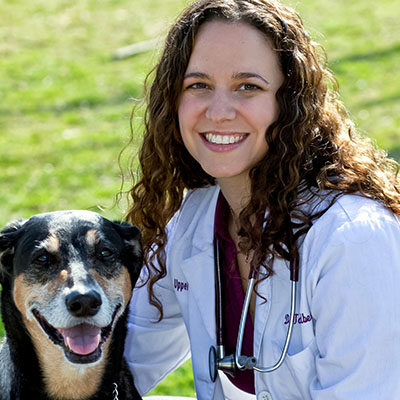 Headshot of Dr. Talia Goldberg, DVM with her dog